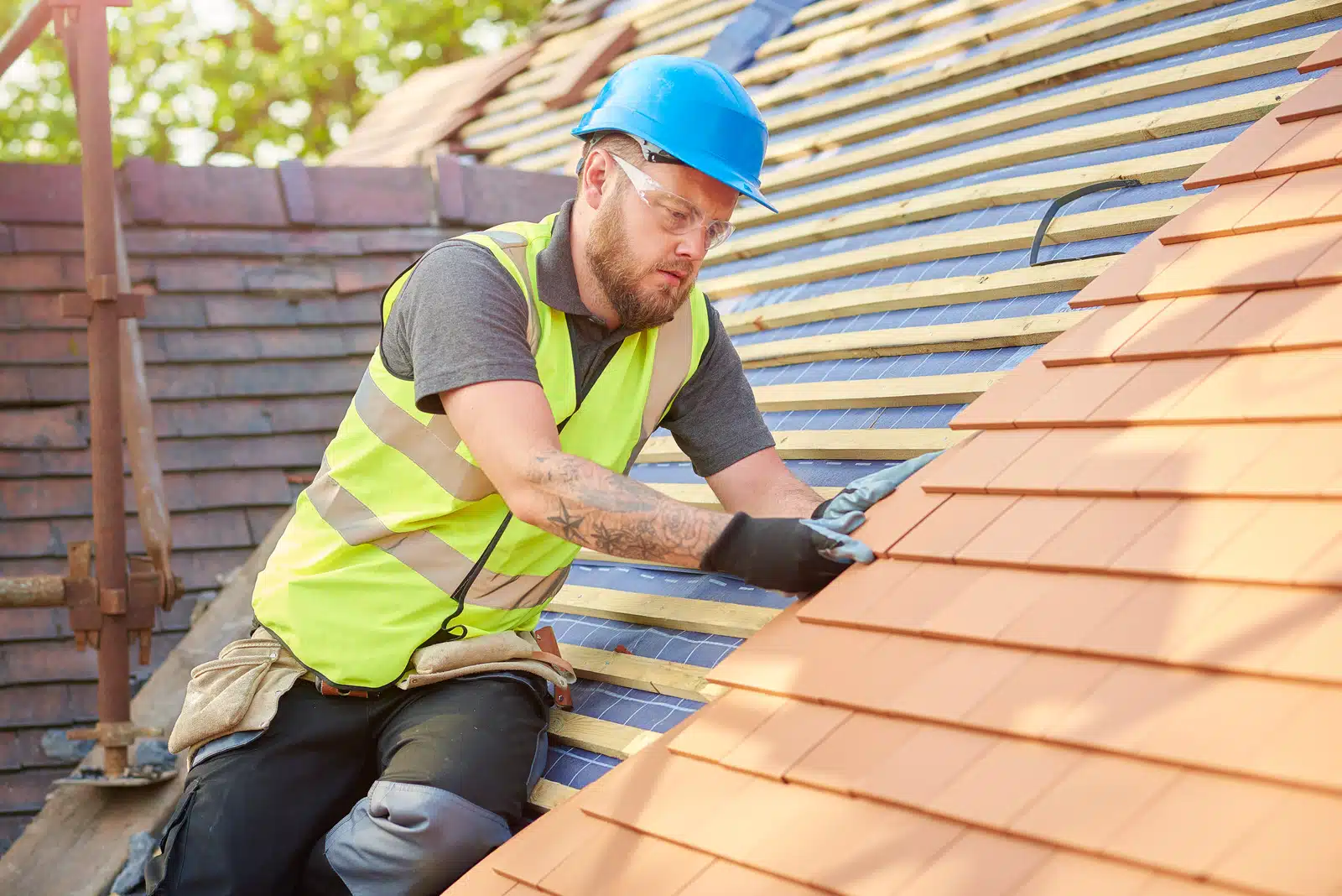 Roofer working on roof
